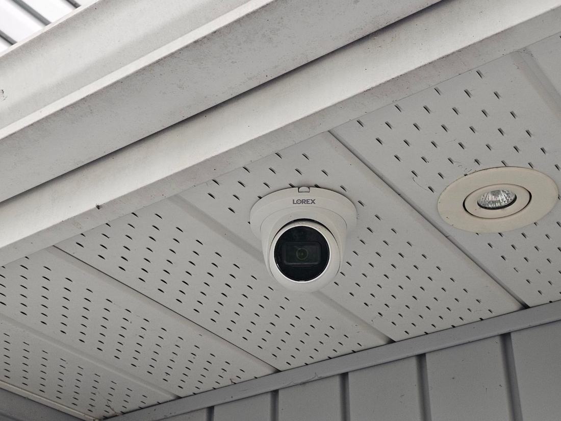 Lorex security camera mounted in a soffit